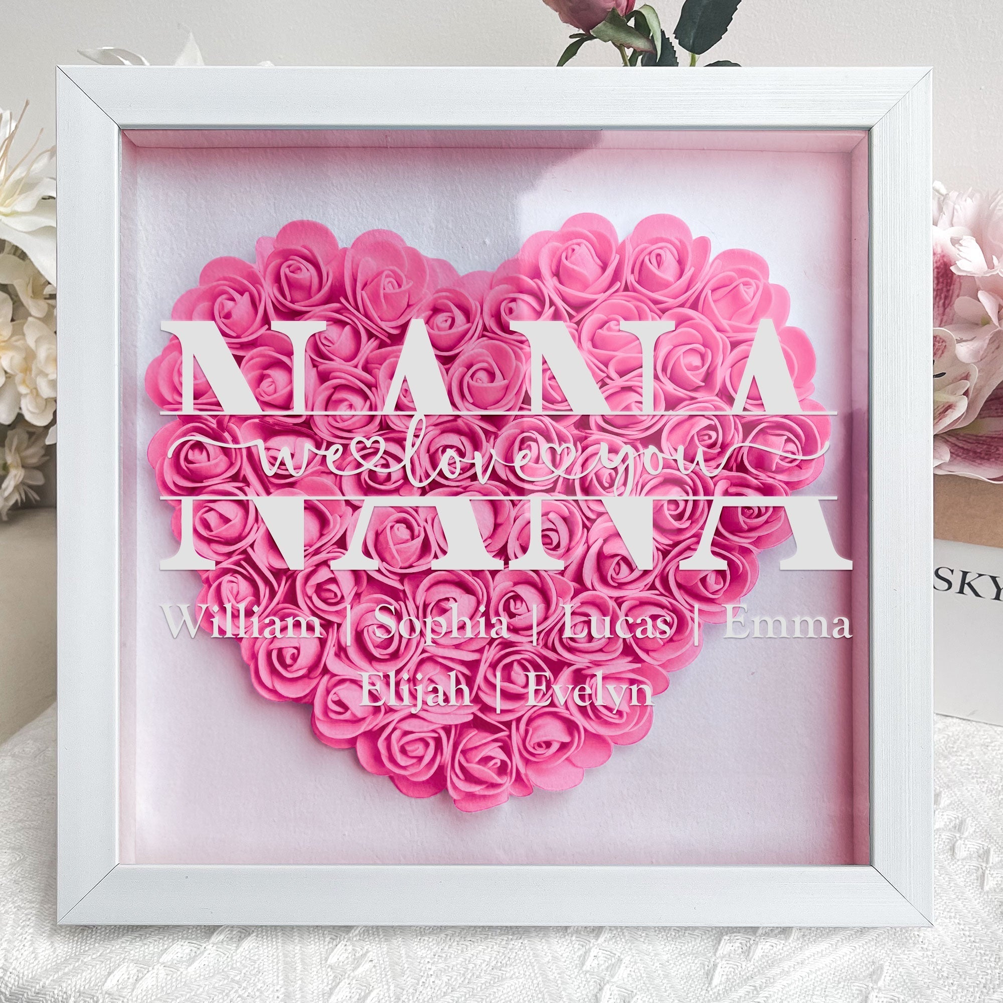 Personalized MAMA flower shadow box for Mom. Pink heart-shaped flower arrangement, white MDF frame, Mother's Day Gift.